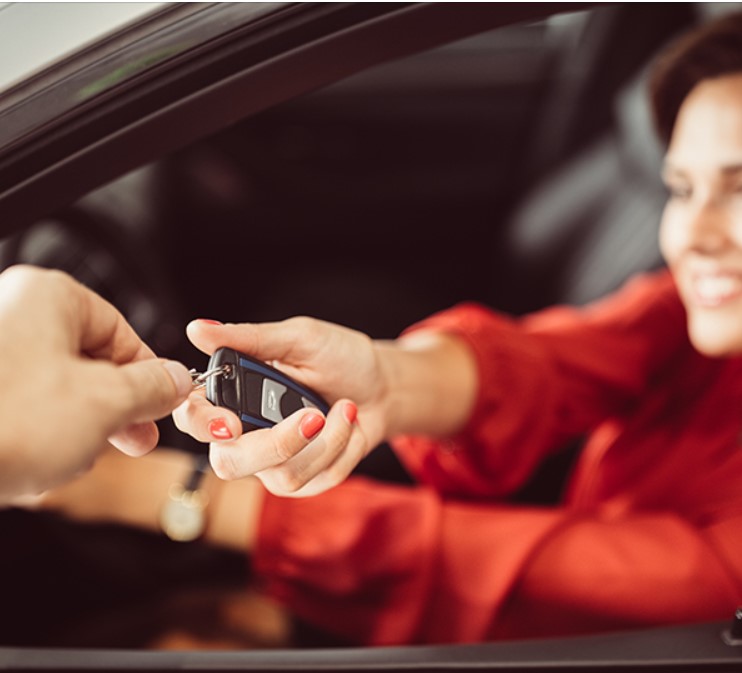 Woman receiving keys
