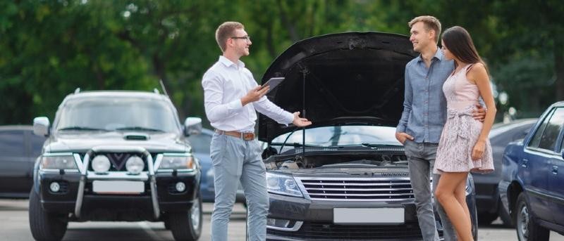Couple at car dealership