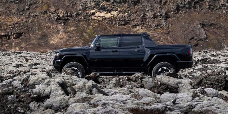 2025 GMC Hummer-EV-Pickup running on rocks img